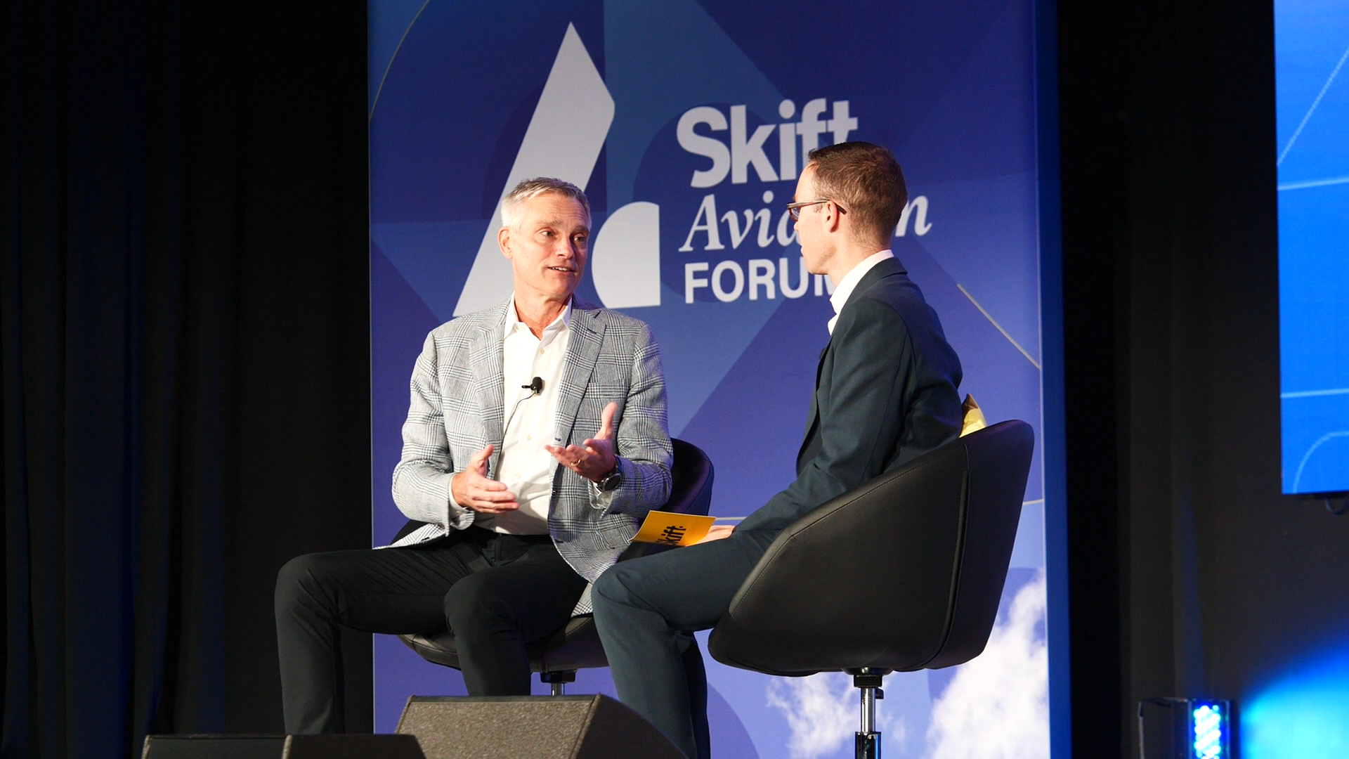 Robert Isom, American Airlines CEO speaking on stage with Edward Russell, Editor, Skift Airline Weekly at Skift Aviation Forum 2022