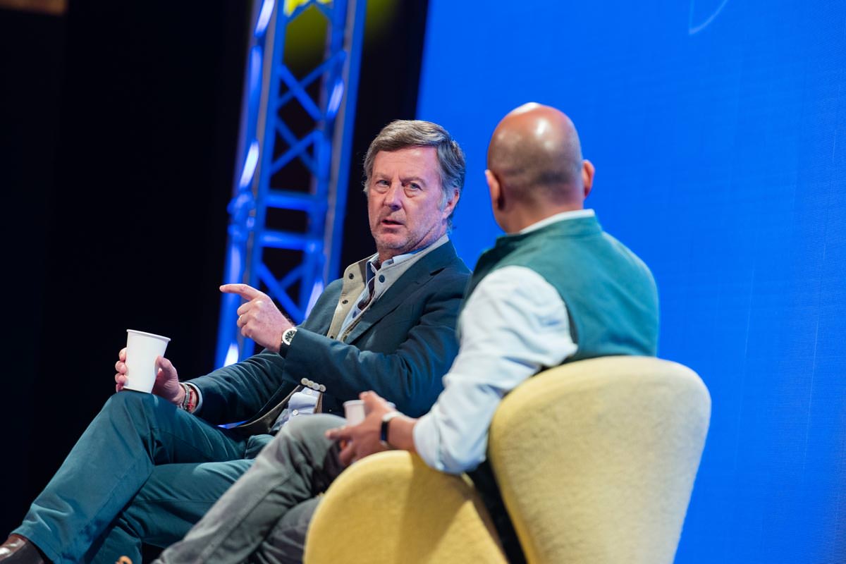 Chief Executive Officer of AccorHotels Sebastien Bazin speaking on stage with CEO of Skift Rafat Ali at SFE 2022 