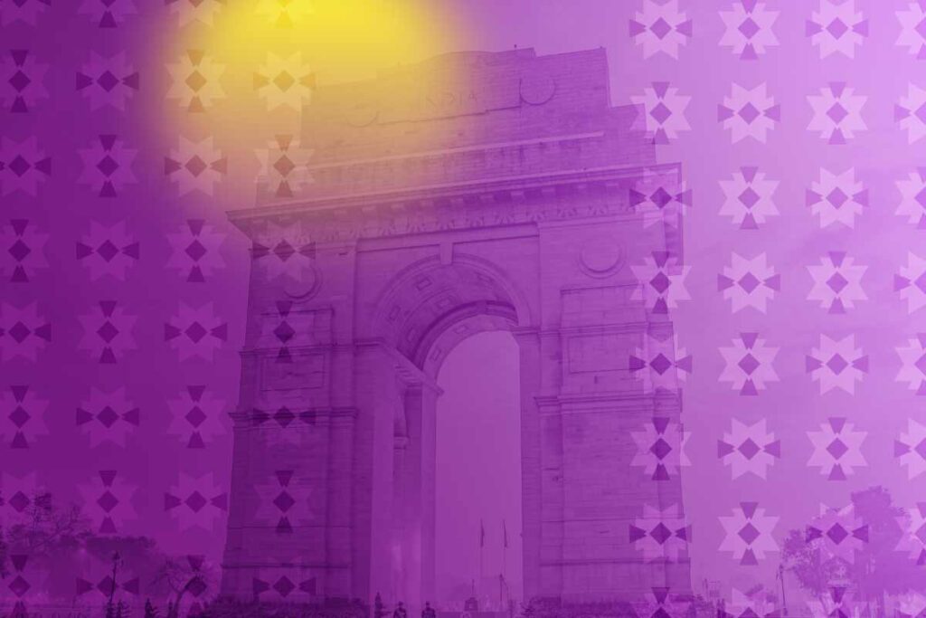 Background photo of a Dehli landmark in India with a purple overlay and a yellow spot for the trademark of Skift Live Events