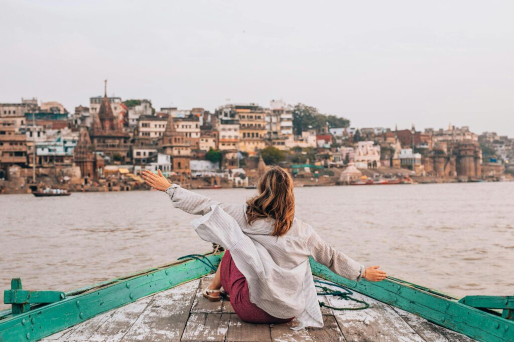 tourist on a boat at the bank of river Ganga in Varanasi