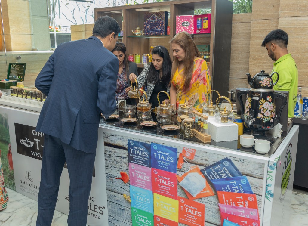 an attendee indulging in a conversation at tea counter at Skift India Forum